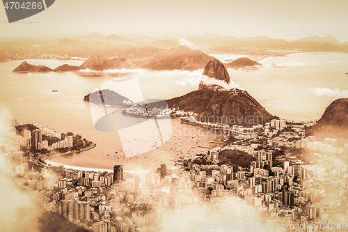 Image of Rio de Janeiro, Brazil. Suggar Loaf and Botafogo beach viewed from Corcovado at sunset