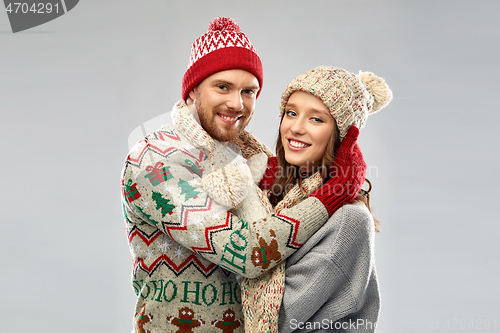 Image of happy couple at christmas ugly sweater party