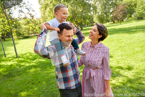 Image of happy family having fun at summer park