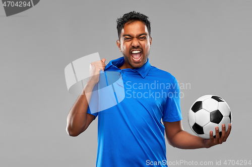 Image of angry indian male football fan with soccer ball