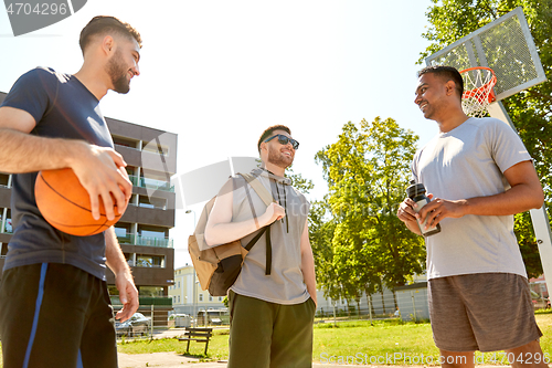 Image of group of male friends going to play basketball