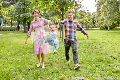 Image of happy family having fun at summer park