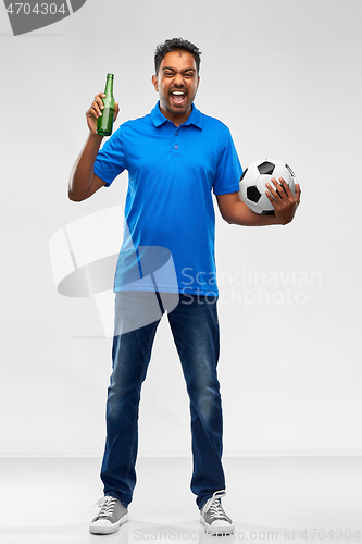 Image of football fan with soccer ball celebrating victory