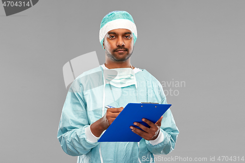 Image of indian male doctor or surgeon with clipboard