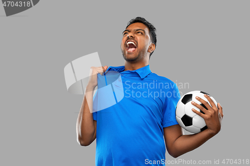 Image of angry indian male football fan with soccer ball