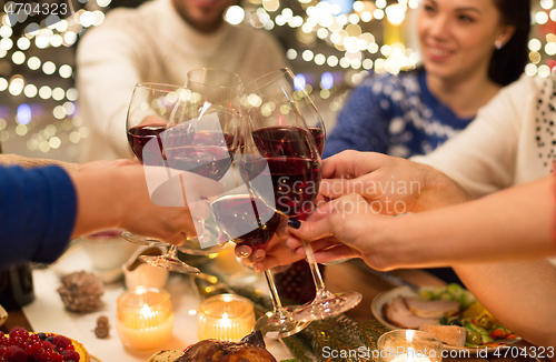 Image of close up of friends with wine celebrate christmas