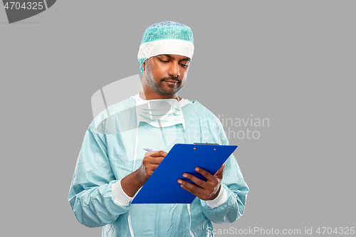 Image of indian male doctor or surgeon with clipboard