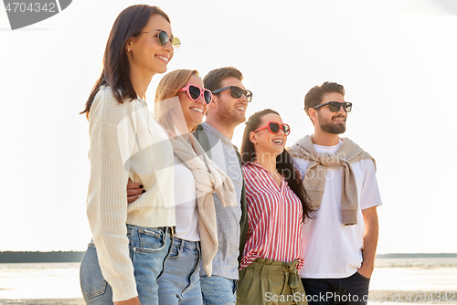 Image of happy friends on summer beach