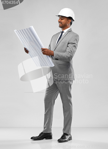 Image of indian male architect in helmet with blueprint