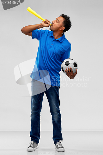 Image of male football fan with soccer ball and vuvuzela