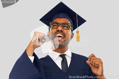 Image of happy indian graduate student celebrating success