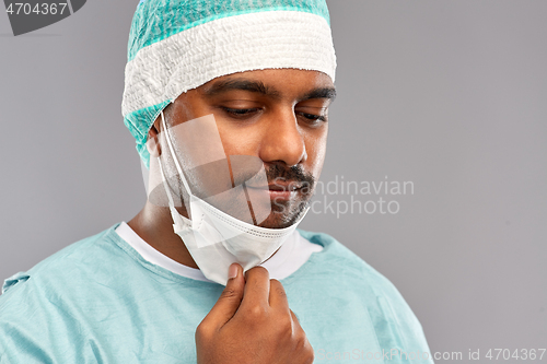 Image of face of sad doctor or surgeon with protective mask