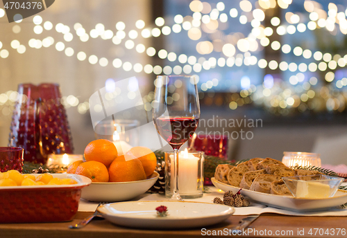 Image of glass of red wine and food on christmas table