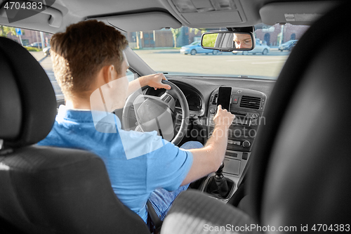 Image of man or driver driving car and using gps navigator