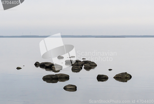 Image of Scene with rocks in calm water