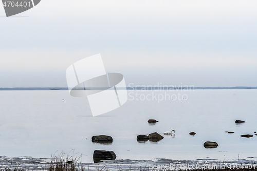 Image of Seascape with rocks in calm water