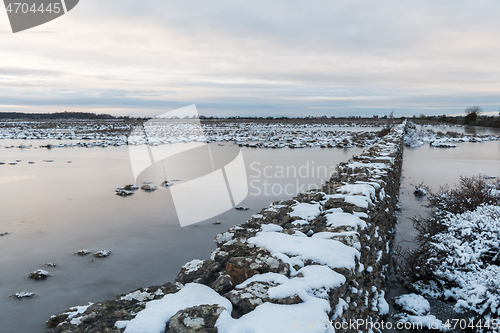 Image of Dry stone wall in a flooded grassland