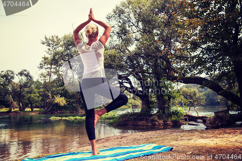 Image of woman meditating and doing yoga exercise