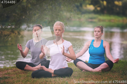 Image of women meditating and doing yoga exercise