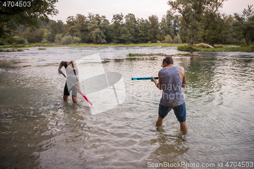 Image of young men having fun with water guns