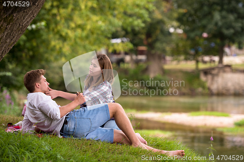 Image of Couple in love enjoying picnic time