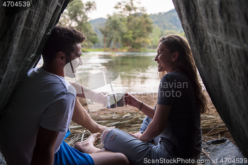 Image of couple spending time together in straw tent