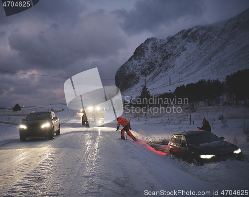 Image of Car being towed after accident in snow storm