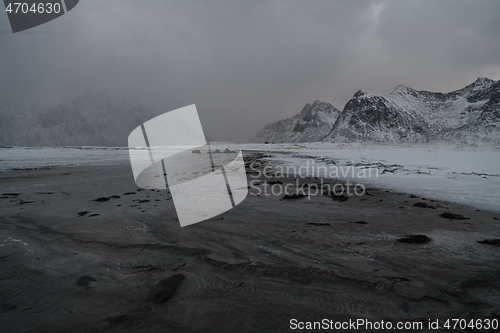 Image of norway coast in winter with snow bad cloudy weather