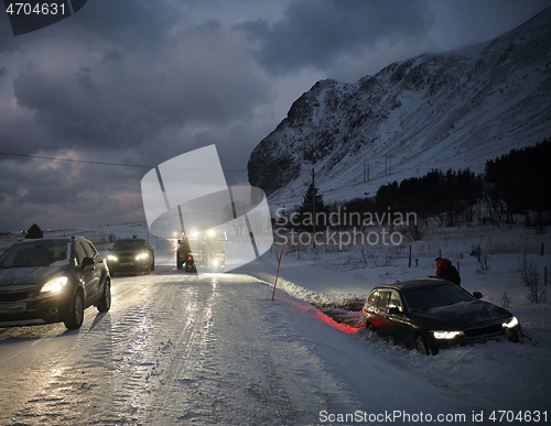 Image of Car being towed after accident in snow storm