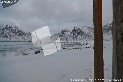 Image of norway coast in winter with snow bad cloudy weather