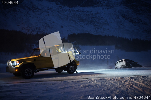 Image of Car being towed after accident in snow storm