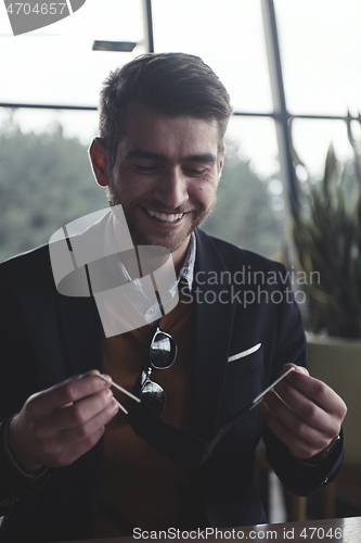 Image of business man wearing protective face mask at luxury office