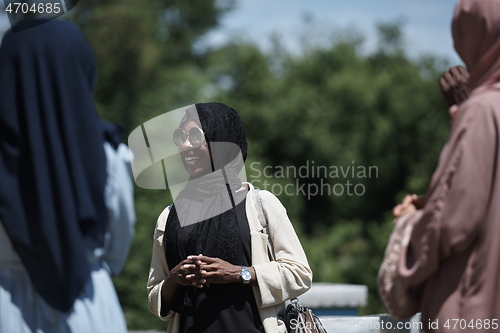 Image of woman giving presentation to group of business investors on local honey production farm