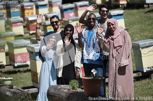 Image of people group visiting local honey production farm