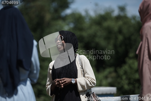 Image of woman giving presentation to group of business investors on local honey production farm