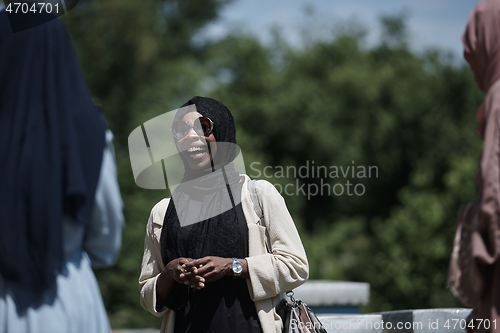 Image of woman giving presentation to group of business investors on local honey production farm