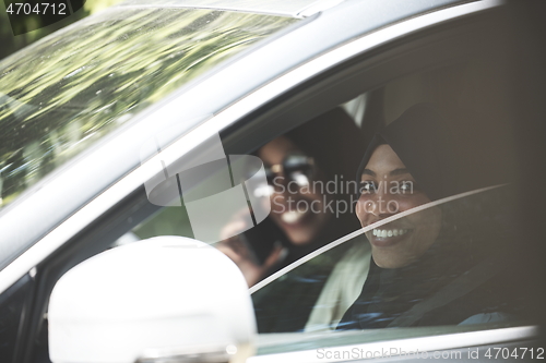 Image of Arabic Woman Couple Traveling By Car