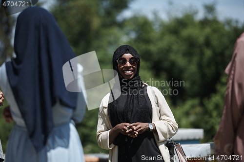 Image of woman giving presentation to group of business investors on local honey production farm