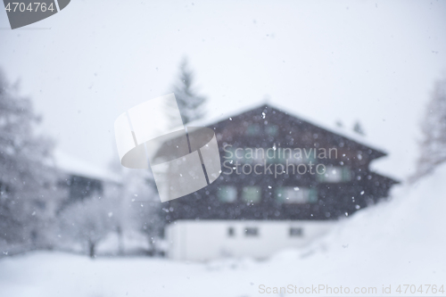 Image of mountain house in snowstorm