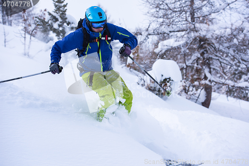 Image of freeride skier skiing downhill