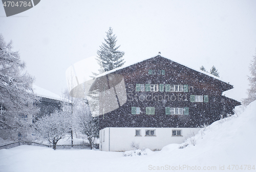 Image of mountain house in snowstorm