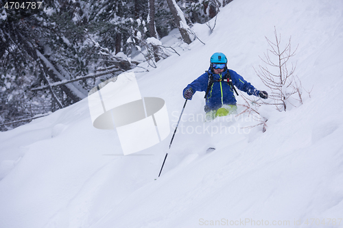 Image of freeride skier skiing downhill