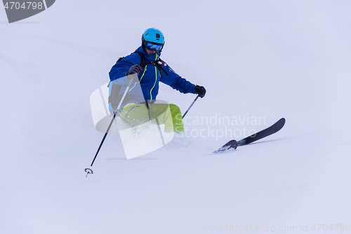 Image of freeride skier skiing downhill