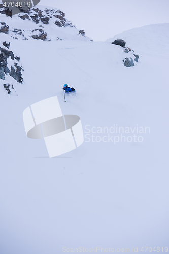 Image of freeride skier skiing downhill