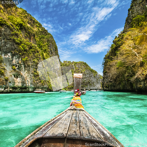 Image of Traditional wooden boat in a picture perfect tropical bay on Koh Phi Phi Island, Thailand, Asia