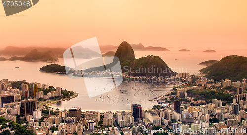 Image of Rio de Janeiro, Brazil. Suggar Loaf and Botafogo beach viewed from Corcovado at sunset