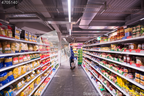 Image of Man shopping in modern supermarket