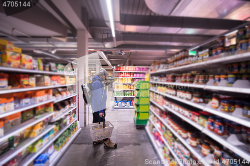 Image of Man shopping in modern supermarket