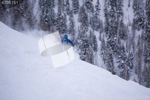 Image of freeride skier skiing downhill