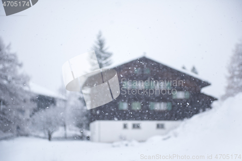 Image of mountain house in snowstorm